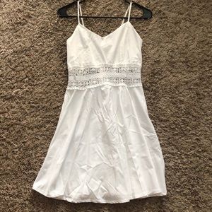 Cute white dress, with open design.